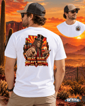 Arizona Shock Rock Squatch Bigfoot T-shirt design featuring a fierce Sasquatch wearing a skull-studded black top hat, rugged leather vest, and rock-star accessories against a fiery Arizona desert sunset with saguaro cacti.