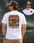 Oklahoma Bigfoot rock and roll T-shirt featuring Sasquatch playing a red electric guitar in a vintage hard rock design by Bigfoot Coast to Coast.